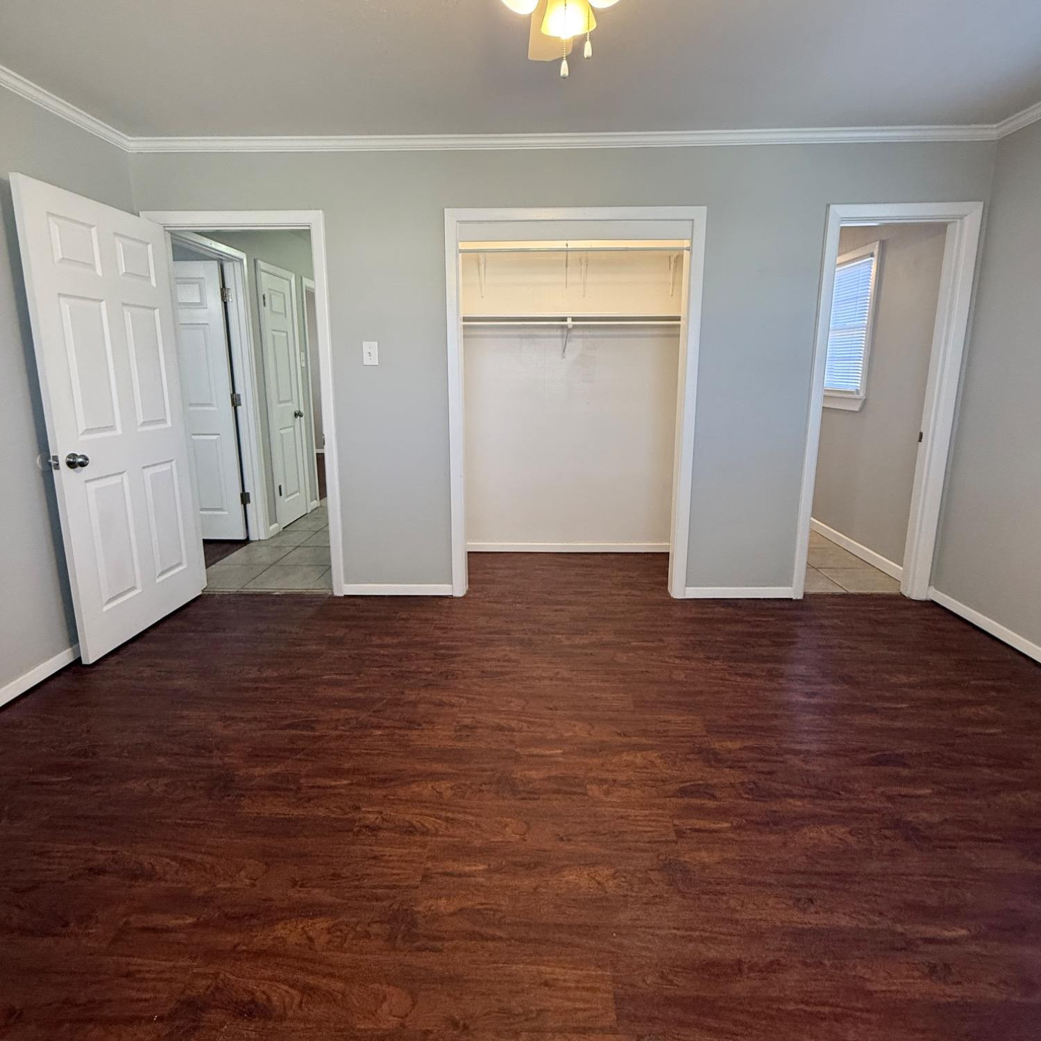 2806 54th Street Lubbock, TX 79413 - Photo 20 of 23 an empty room with wooden floor and closet