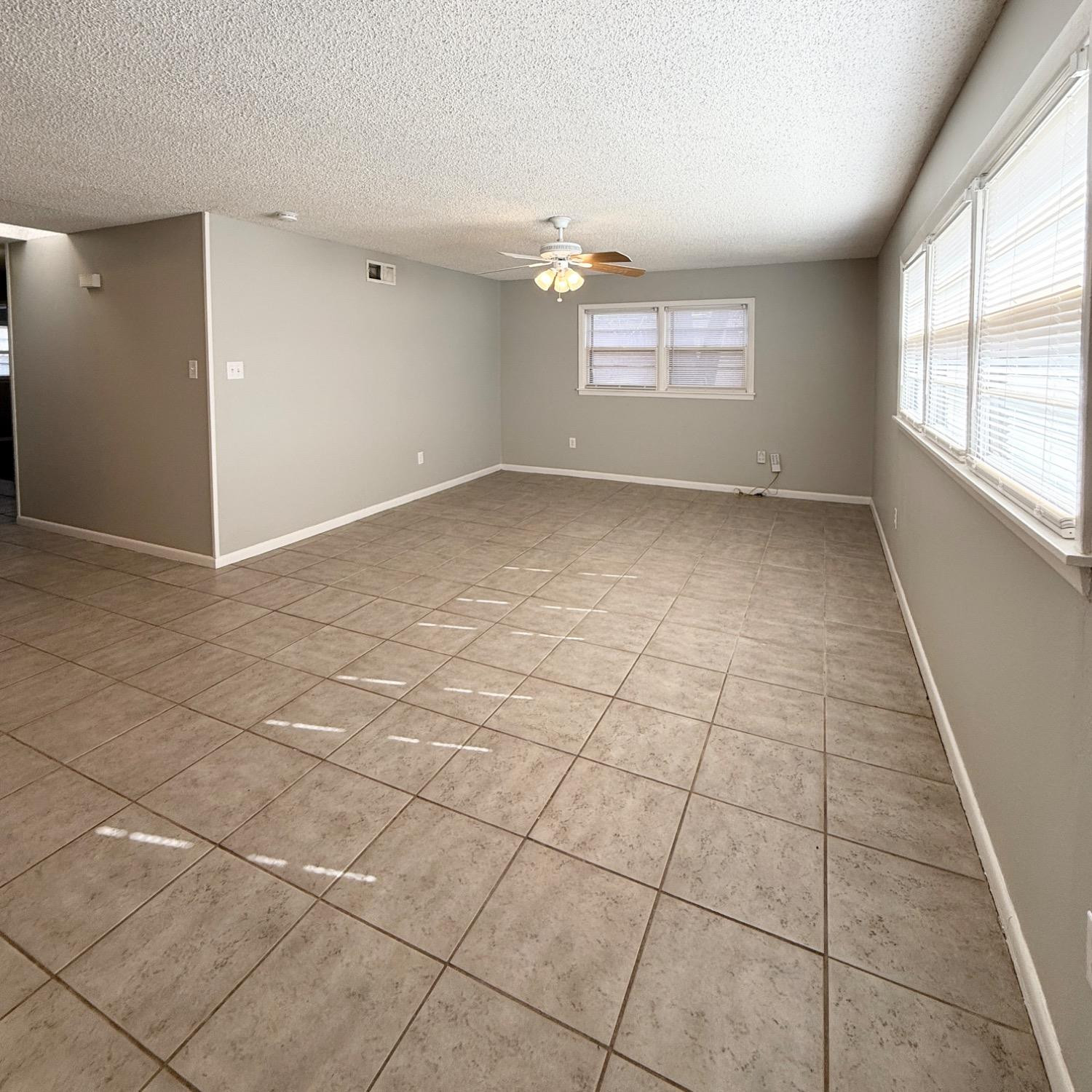 2806 54th Street Lubbock, TX 79413 - Photo 2 of 23 a view of an empty room with a window