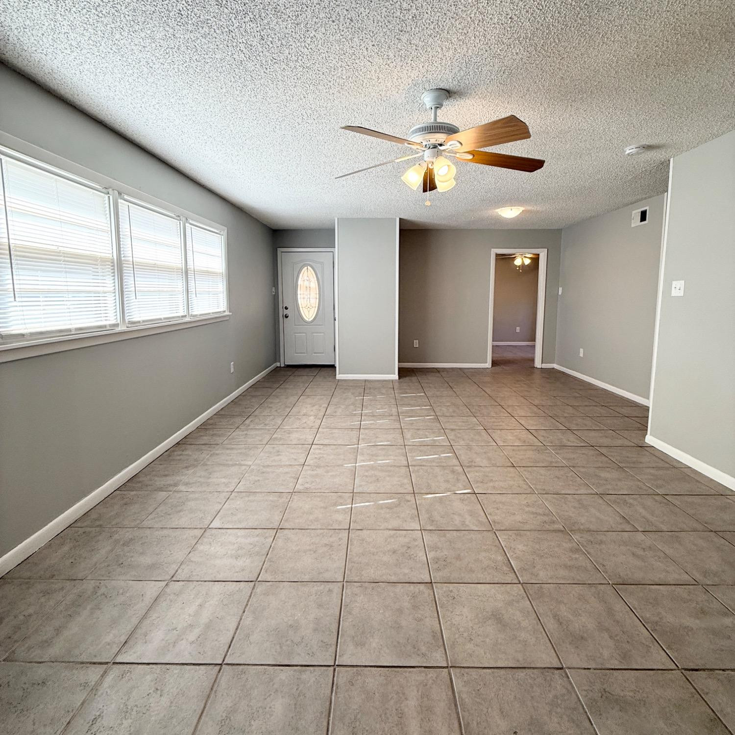 2806 54th Street Lubbock, TX 79413 - Photo 3 of 23 a view of an empty room with a window