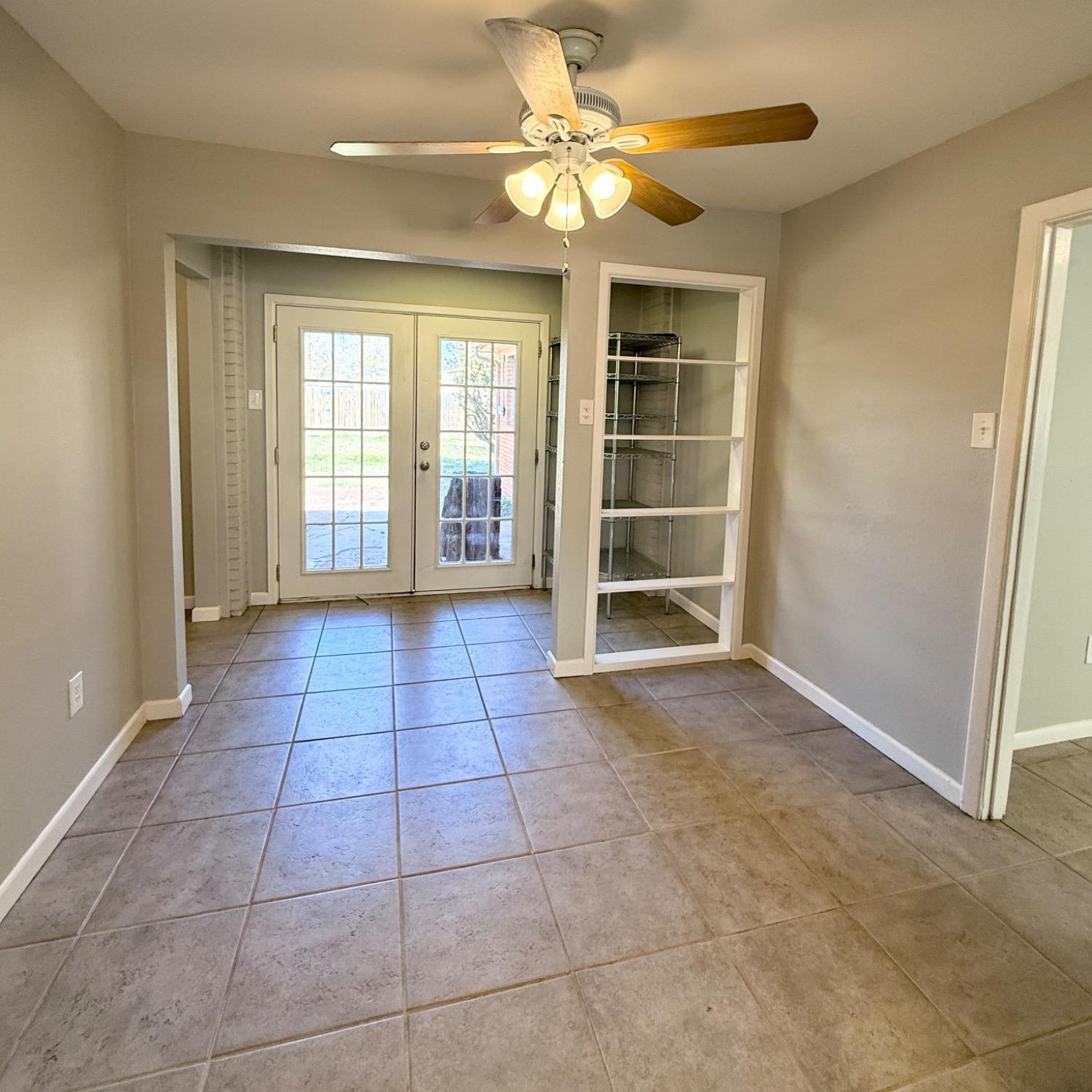 2806 54th Street Lubbock, TX 79413 - Photo 7 of 23 a view of an empty room with a window