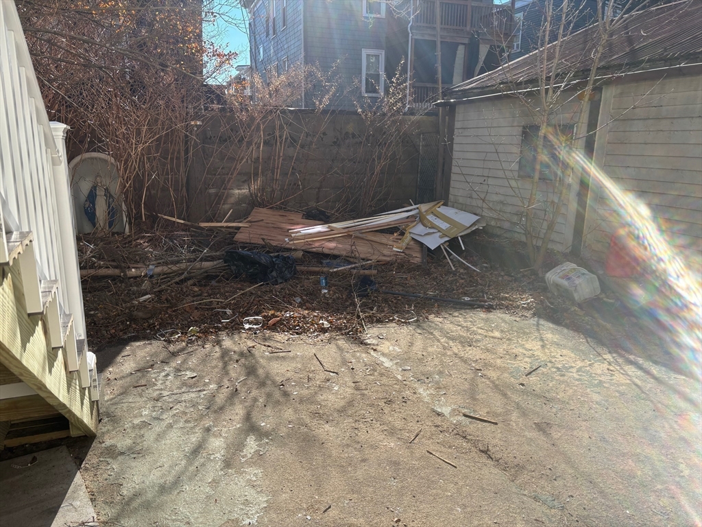 37 Longfellow Street Boston, MA 02122 - Photo 4 of 15 a view of a back yard of the house