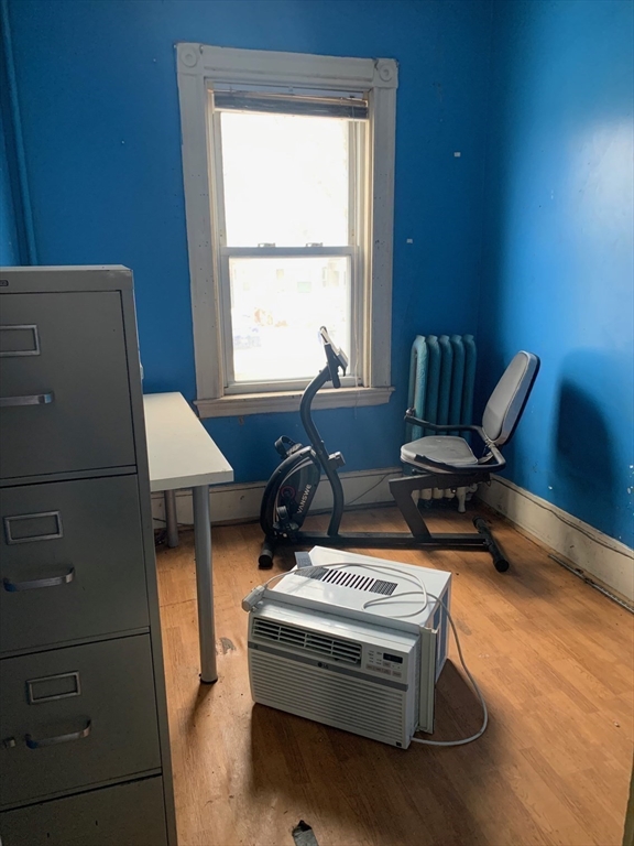 37 Longfellow Street Boston, MA 02122 - Photo 9 of 15 a living room with furniture and a wooden floor