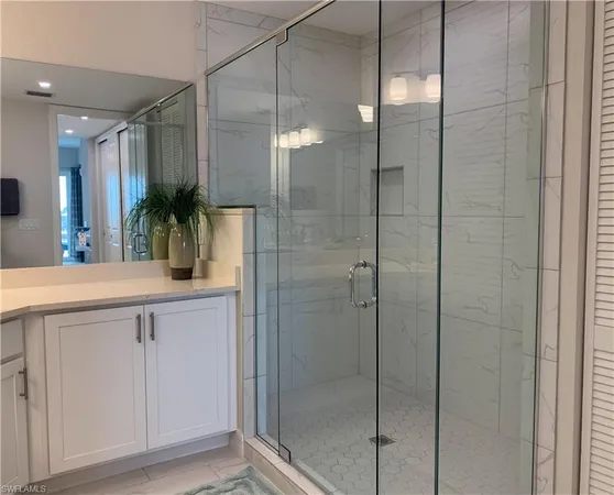 a bathroom with a shower and a sink