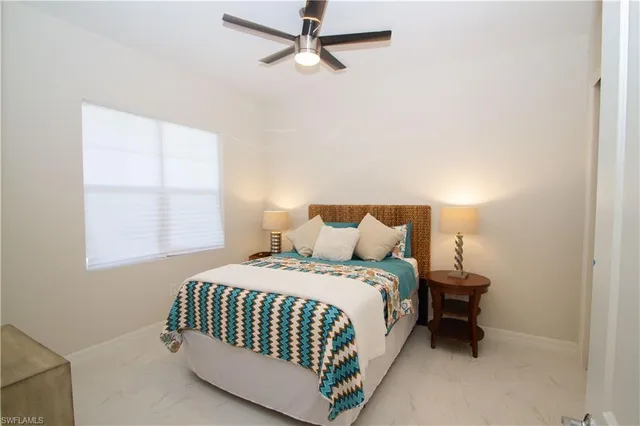 a bedroom with a bed and window