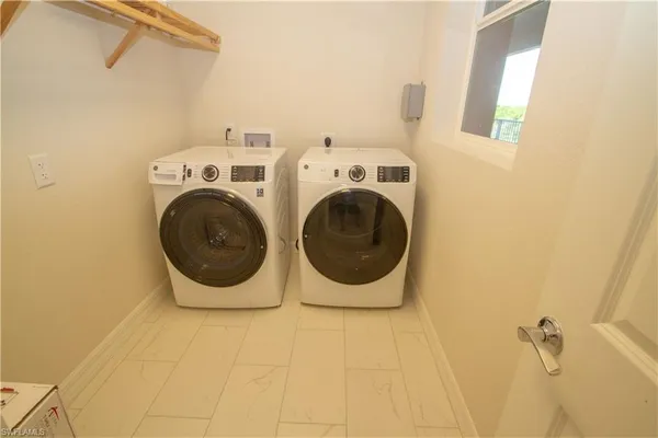 a utility room with dryer and washer