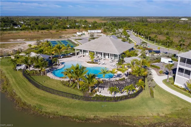 a view of a swimming pool with a yard and mountain view