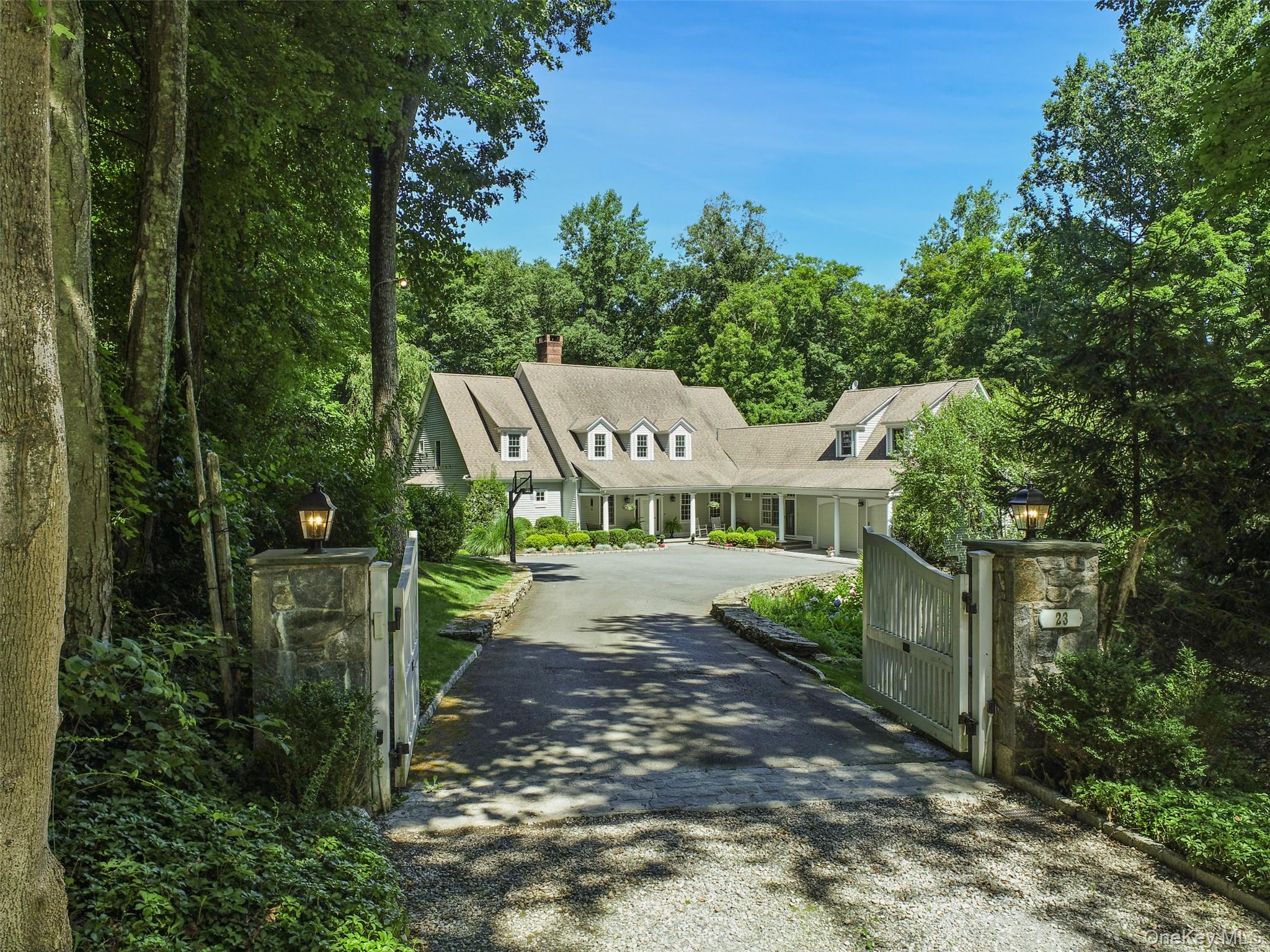 23 Kendall Road Pound Ridge, NY 10576 - Photo 1 of 1 a view of a bench in a garden