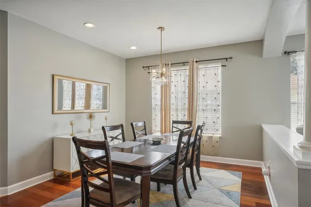 a large kitchen with stainless steel appliances granite countertop a stove and a refrigerator