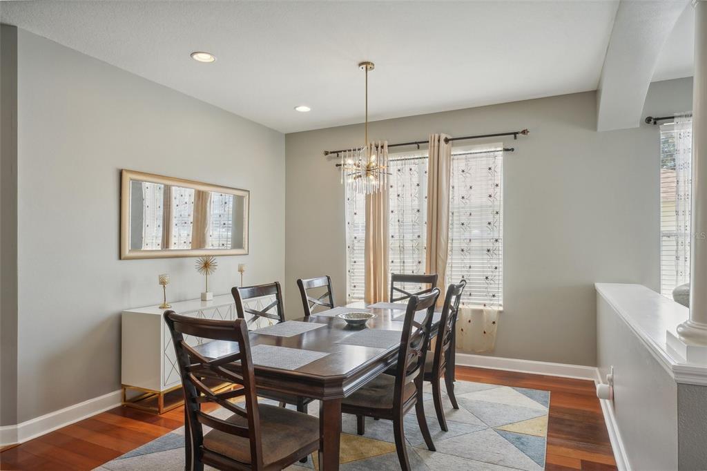 16751 Taylow Way Odessa, FL 33556 - Photo 14 of 54 a view of a a dining room with furniture window and wooden floor