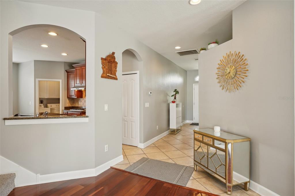 16751 Taylow Way Odessa, FL 33556 - Photo 33 of 54 a view of a hallway with wooden floor and staircase