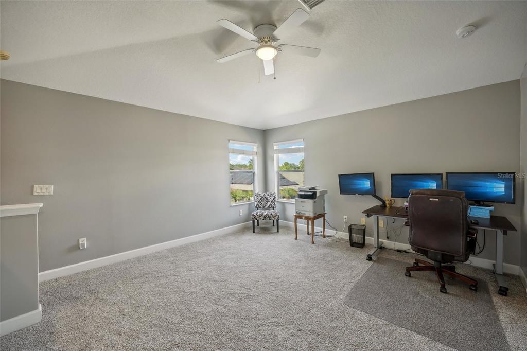 16751 Taylow Way Odessa, FL 33556 - Photo 46 of 54 a view of a workspace with furniture and a window