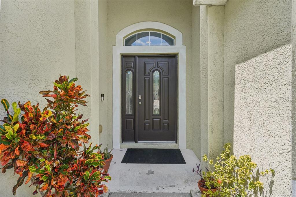 16751 Taylow Way Odessa, FL 33556 - Photo 5 of 54 a view of a entryway door of the house
