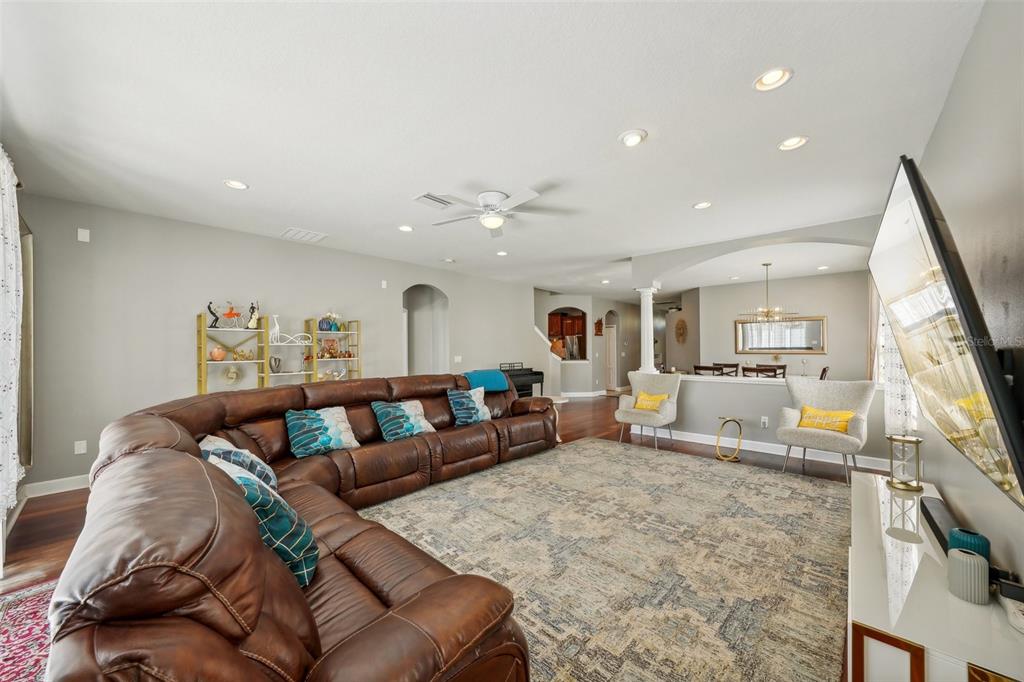 16751 Taylow Way Odessa, FL 33556 - Photo 6 of 54 a living room with furniture and a flat screen tv