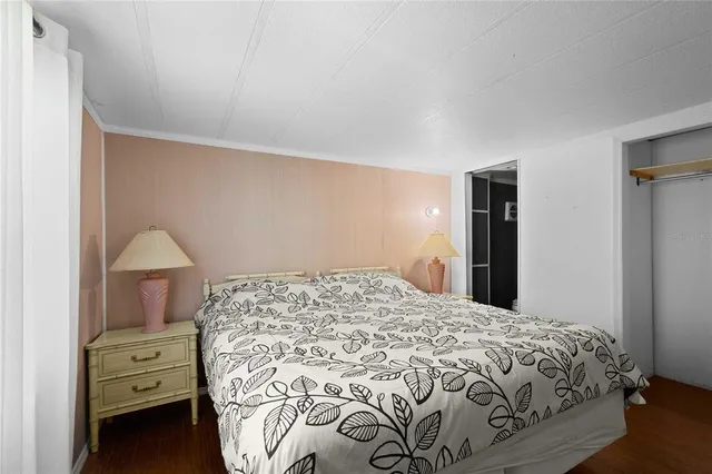 a bedroom with a bed and a closet