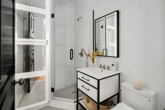 a bathroom with a bathtub and a window