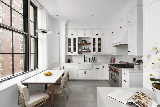 a view of a livingroom with wooden floor and a hallway