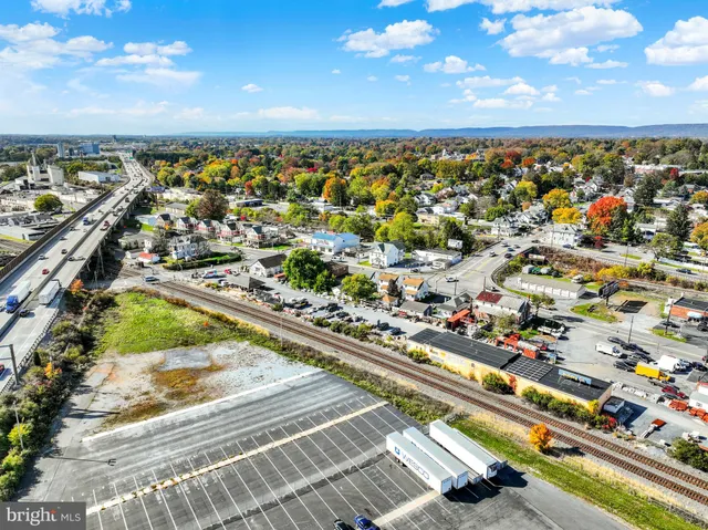 an aerial view of a house with a lake view