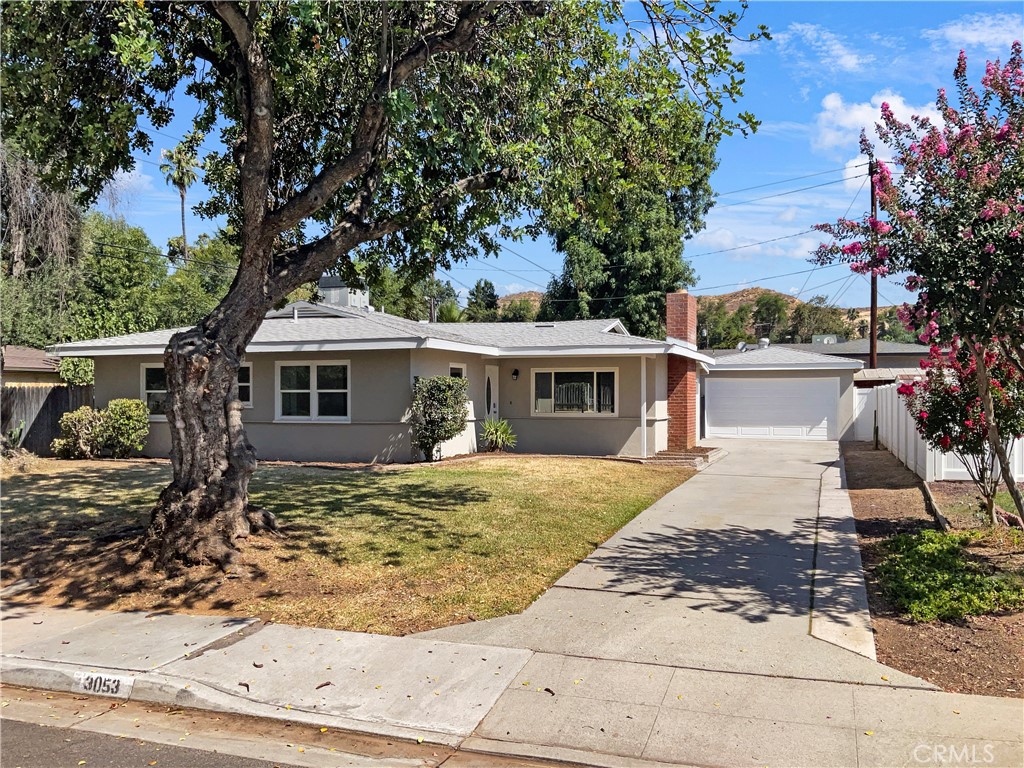 3053 Cimarron Road Riverside, CA 92506 - Photo 1 of 1 a front view of a house with garden