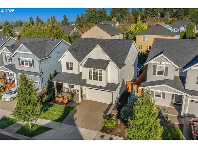 a aerial view of a house with a yard