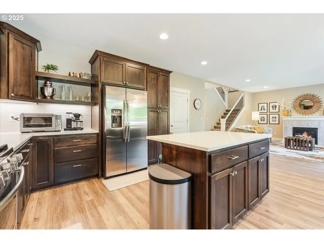 a kitchen with a stove and a refrigerator