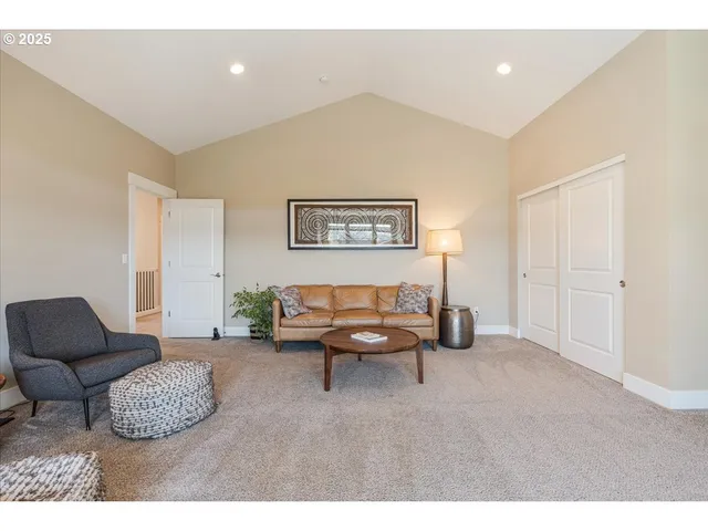 a living room with furniture and a night stand