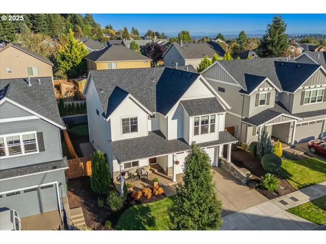 a aerial view of a house with a yard