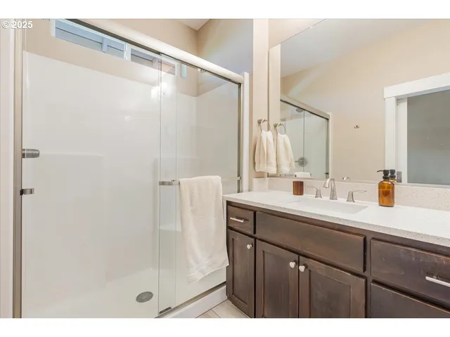a bathroom with a sink and mirror