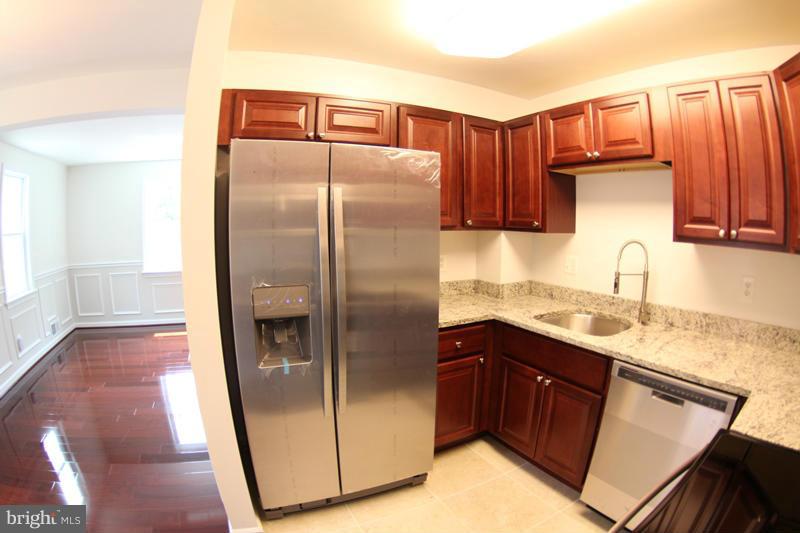 2611 Harris Avenue Silver Spring, MD 20902 - Photo 13 of 30 a kitchen with stainless steel appliances granite countertop a refrigerator a sink and dishwasher