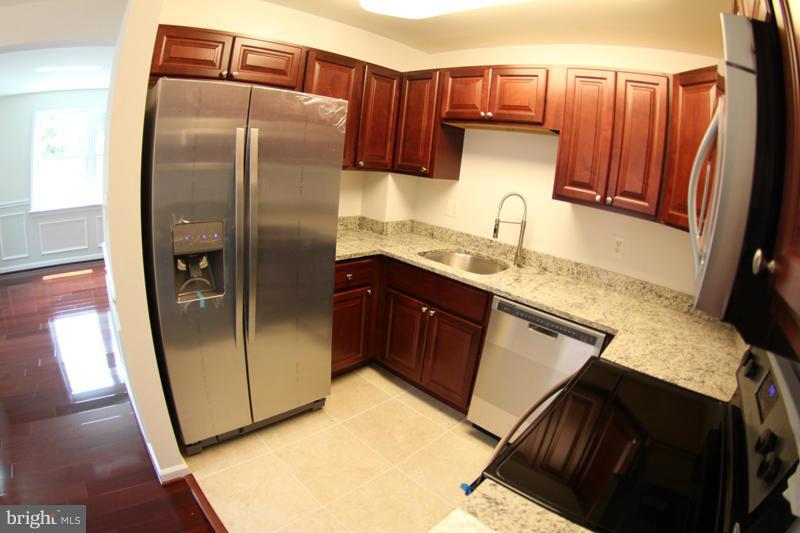 2611 Harris Avenue Silver Spring, MD 20902 - Photo 14 of 30 a kitchen with stainless steel appliances granite countertop a refrigerator a sink and dishwasher