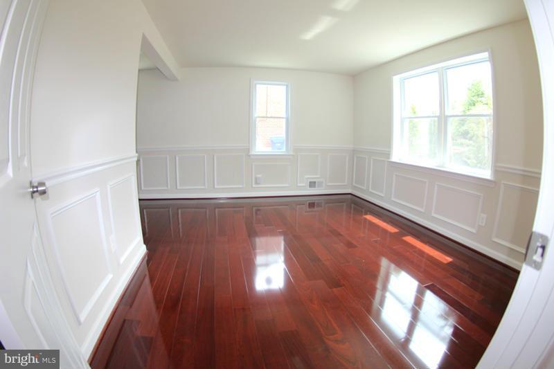 2611 Harris Avenue Silver Spring, MD 20902 - Photo 16 of 30 an empty room with wooden floor and windows