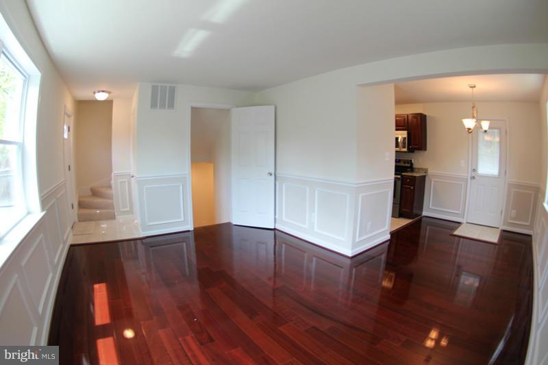 2611 Harris Avenue Silver Spring, MD 20902 - Photo 18 of 30 a view of a kitchen with wooden floor and a kitchen