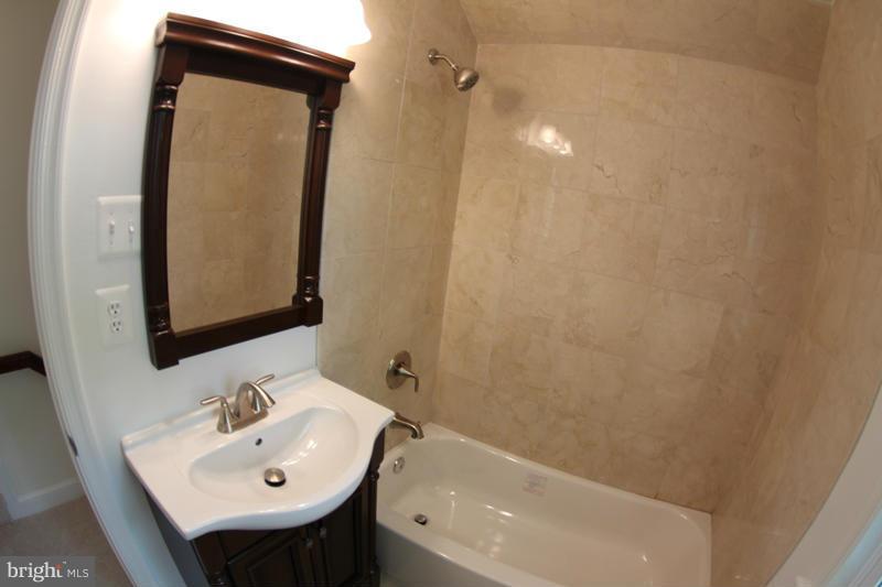 2611 Harris Avenue Silver Spring, MD 20902 - Photo 27 of 30 a bathroom with a sink a toilet and shower