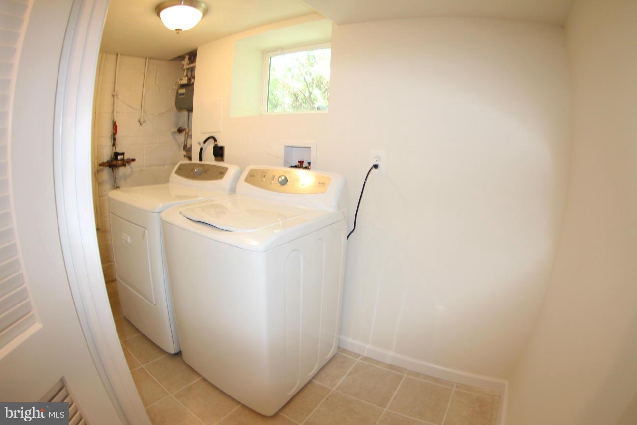 2611 Harris Avenue Silver Spring, MD 20902 - Photo 29 of 30 a utility room with a sink a washer and dryer