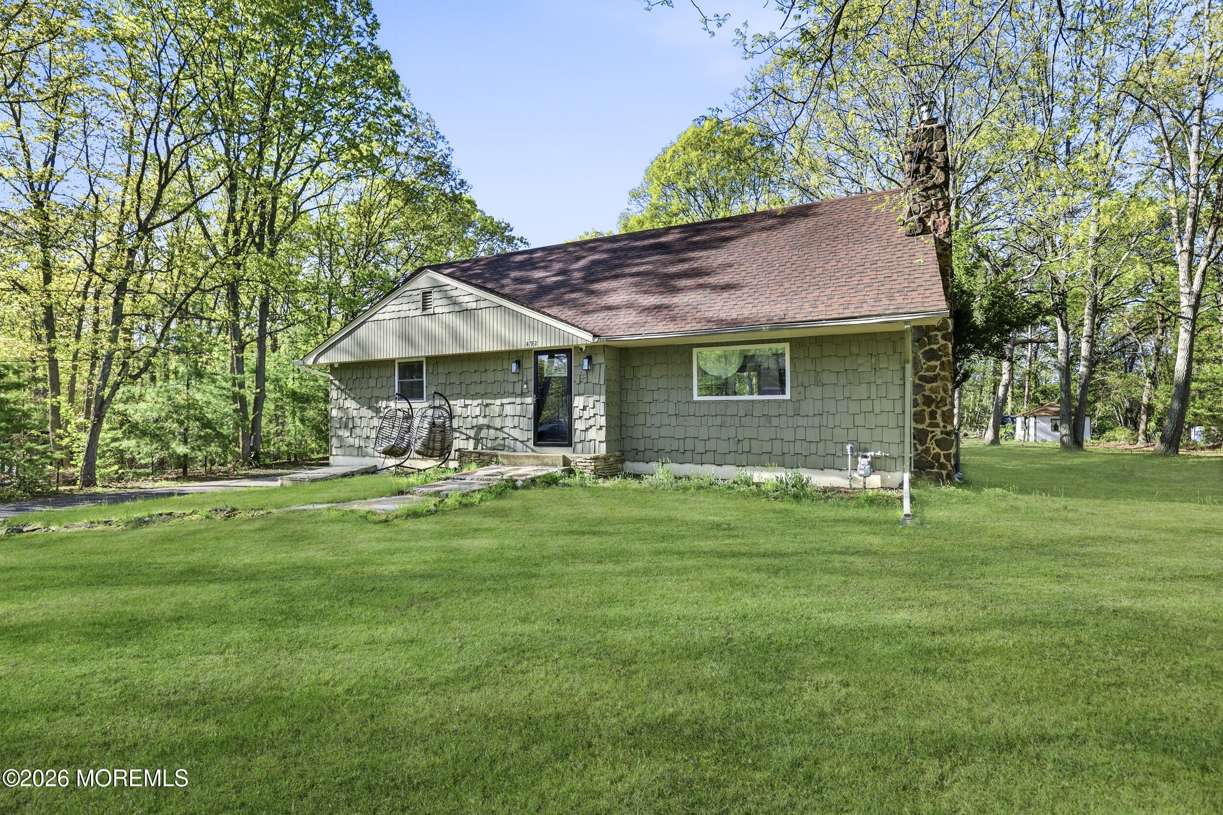 492 Cobain Road Jackson, NJ 08527 - Photo 3 of 47 a backyard of a house with table and chairs