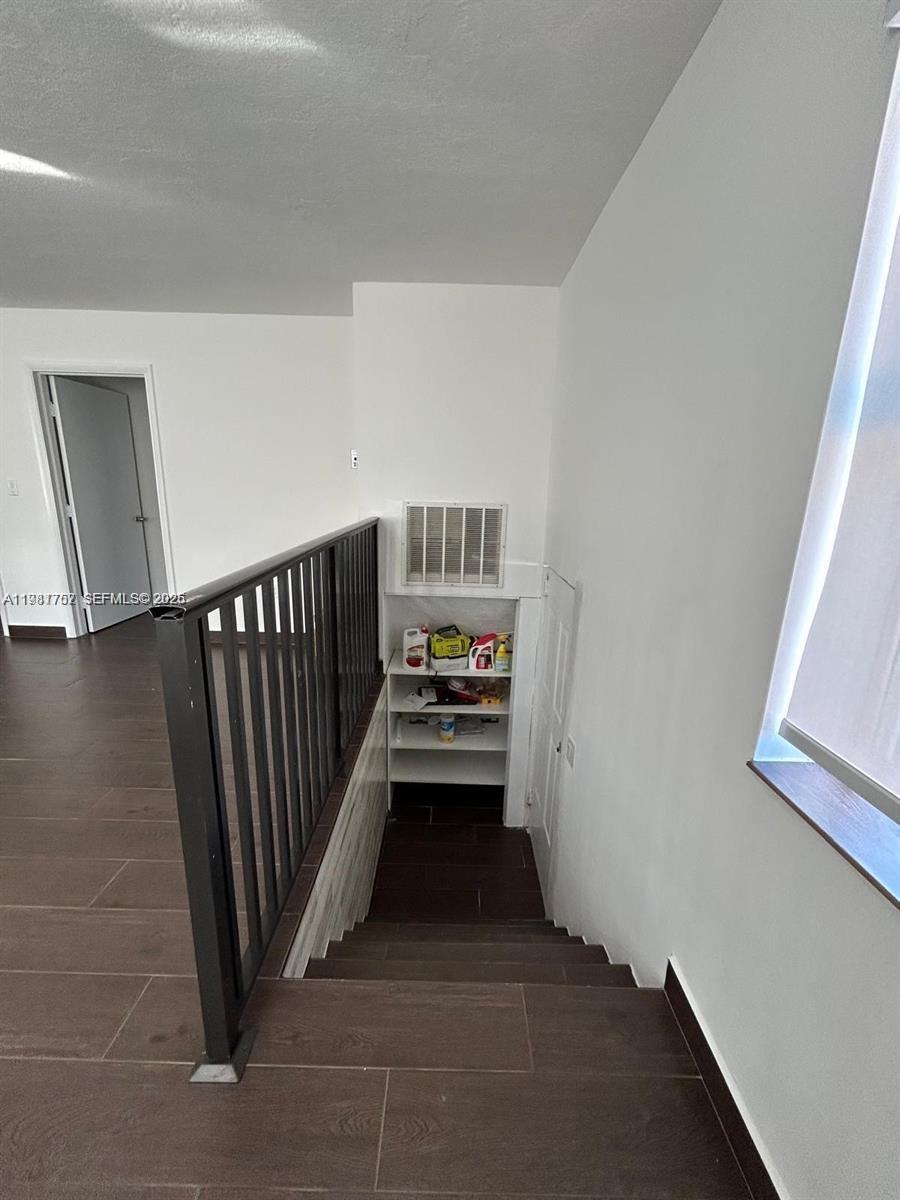 1810 Northwest 34th Street, Unit 2 Miami, FL 33142 - Photo 3 of 11 a view of a hallway with stairs