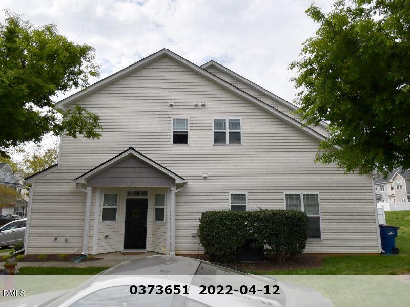 2006 Fieldhouse Avenue Raleigh, NC 27603 - Photo 2 of 8 a view of a grey house with a small yard