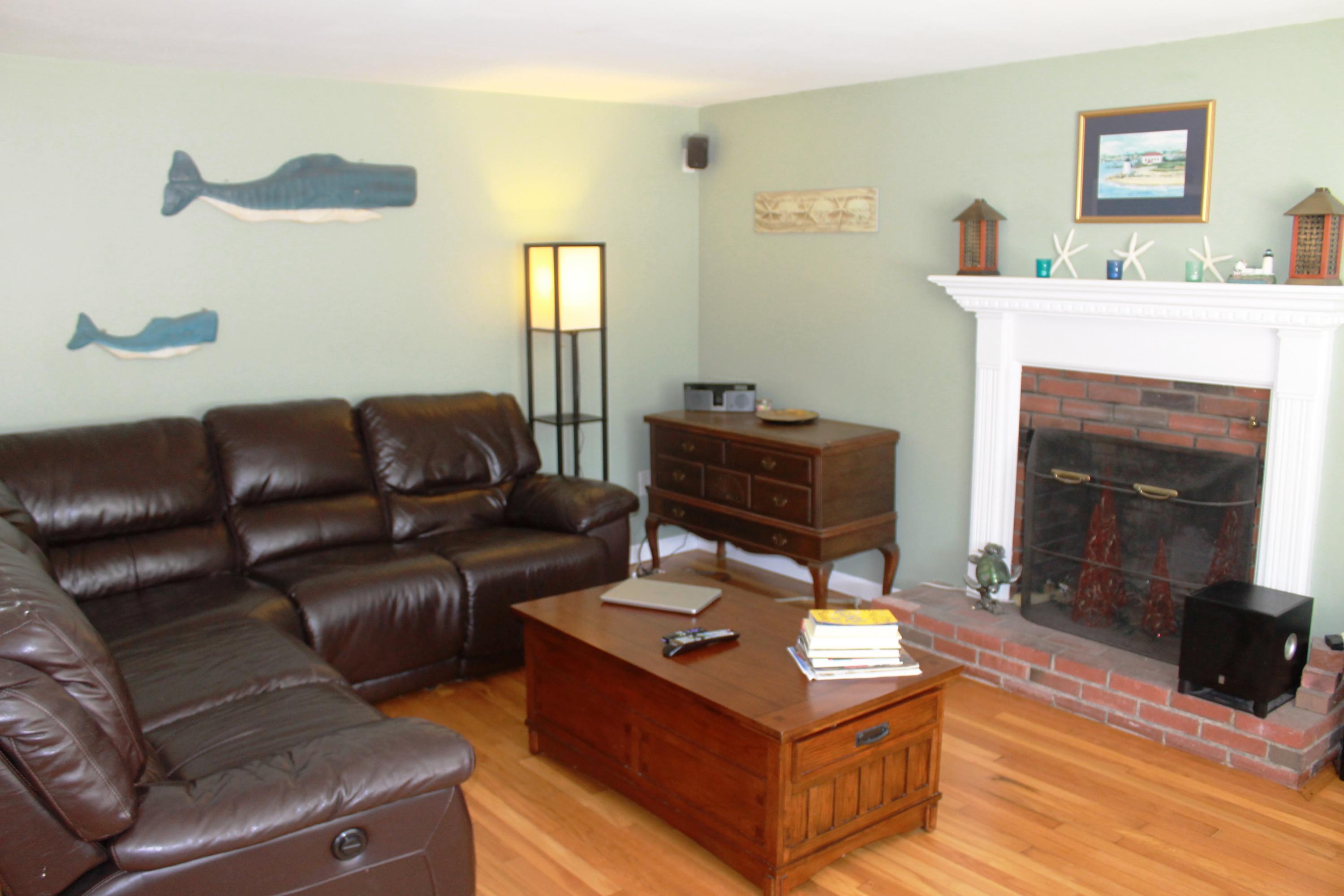5 Juniper Road Centerville, MA 02632 - Photo 24 of 26 a living room with furniture and a fireplace