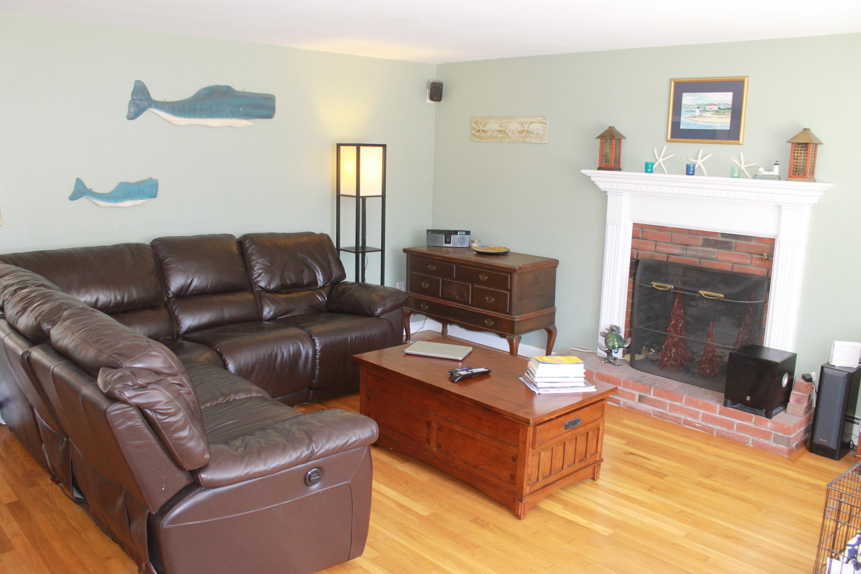 5 Juniper Road Centerville, MA 02632 - Photo 4 of 26 a living room with furniture and a fireplace