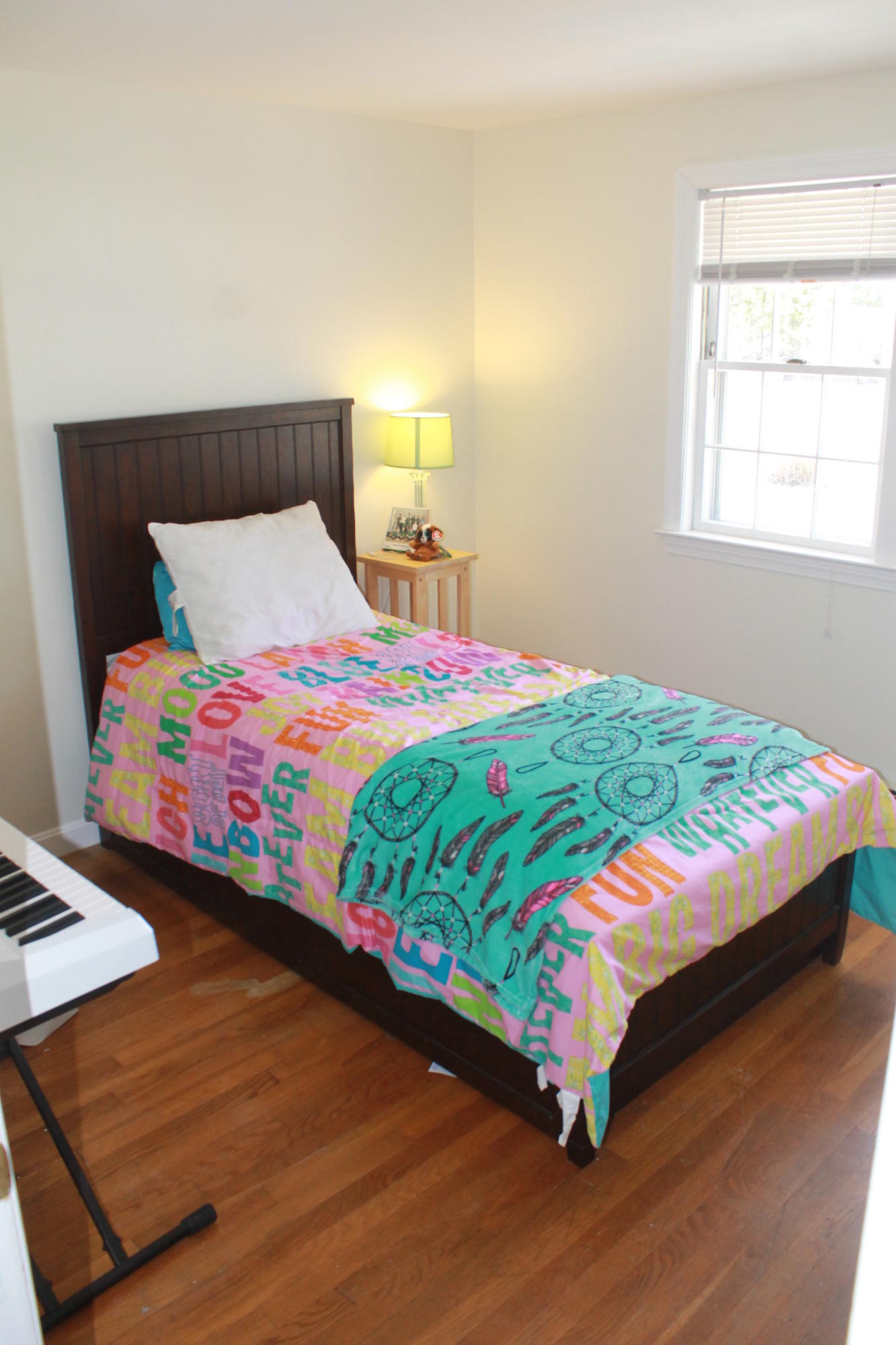 5 Juniper Road Centerville, MA 02632 - Photo 8 of 26 a bedroom with a bed wooden floor and a lamp on table