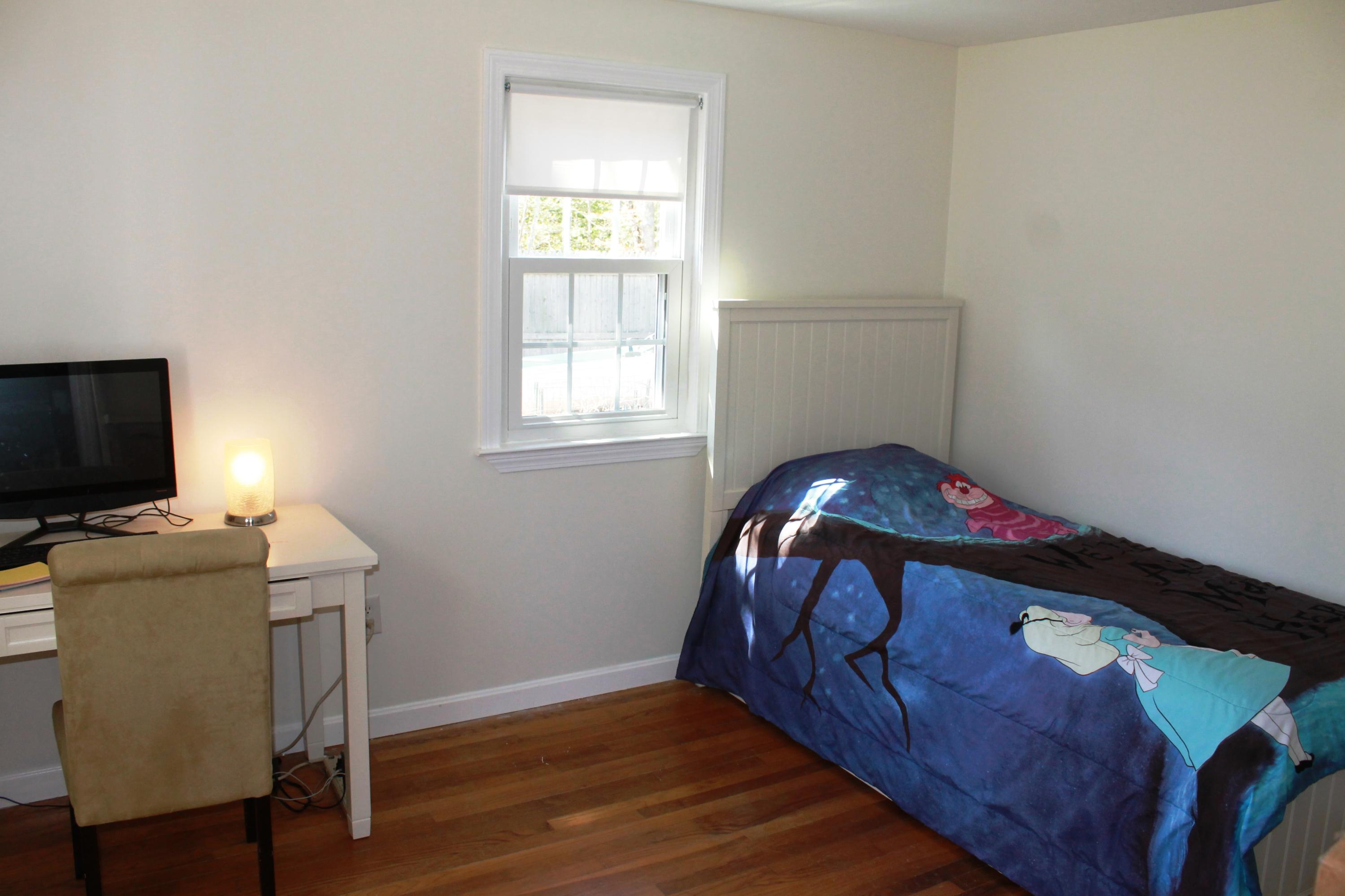 5 Juniper Road Centerville, MA 02632 - Photo 10 of 26 a bedroom with a bed and a flat screen tv