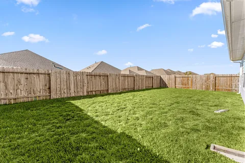a view of a backyard of the house