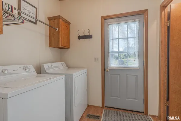a bedroom with bed and window
