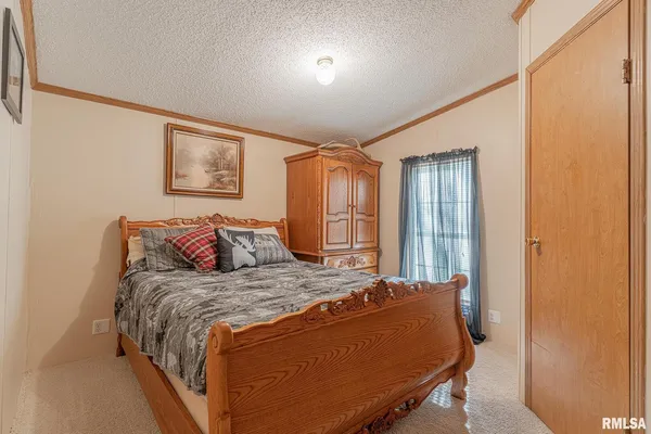 a bedroom with a bed and a cabinets