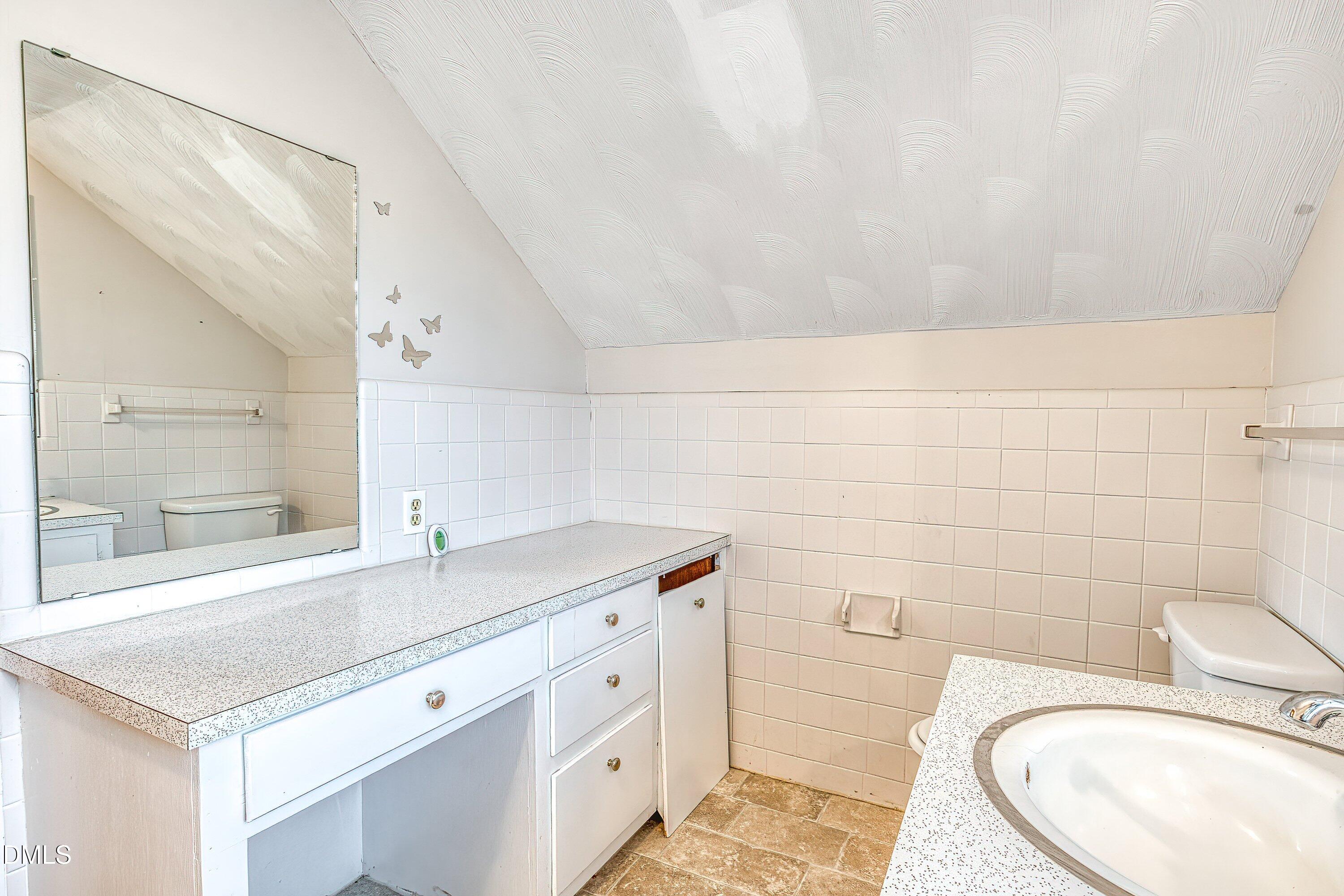 629 East Main Street Clayton, NC 27520 - Photo 31 of 39 a bathroom with a sink toilet and tub