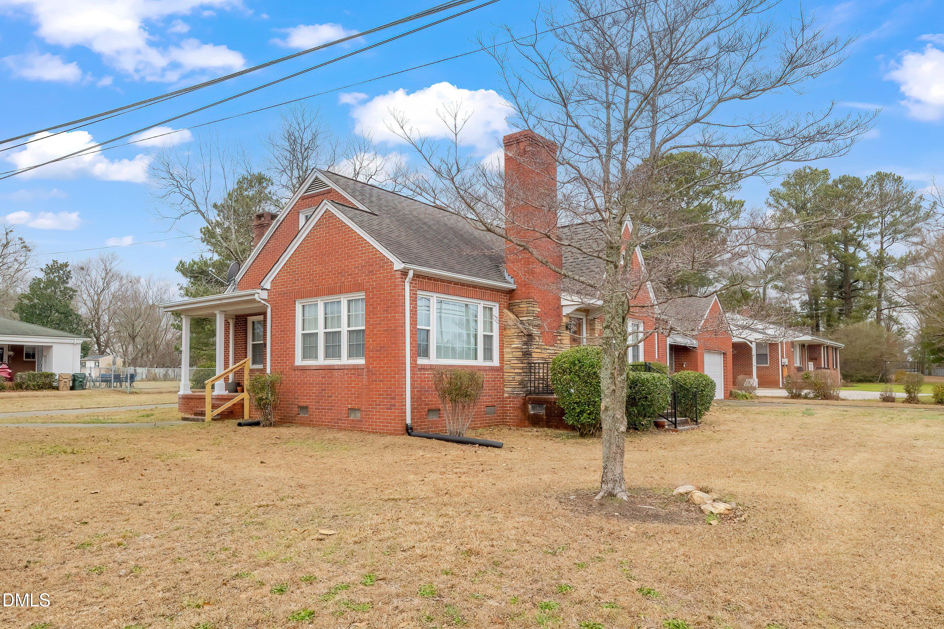 629 East Main Street Clayton, NC 27520 - Photo 36 of 39 a front view of a house with a yard