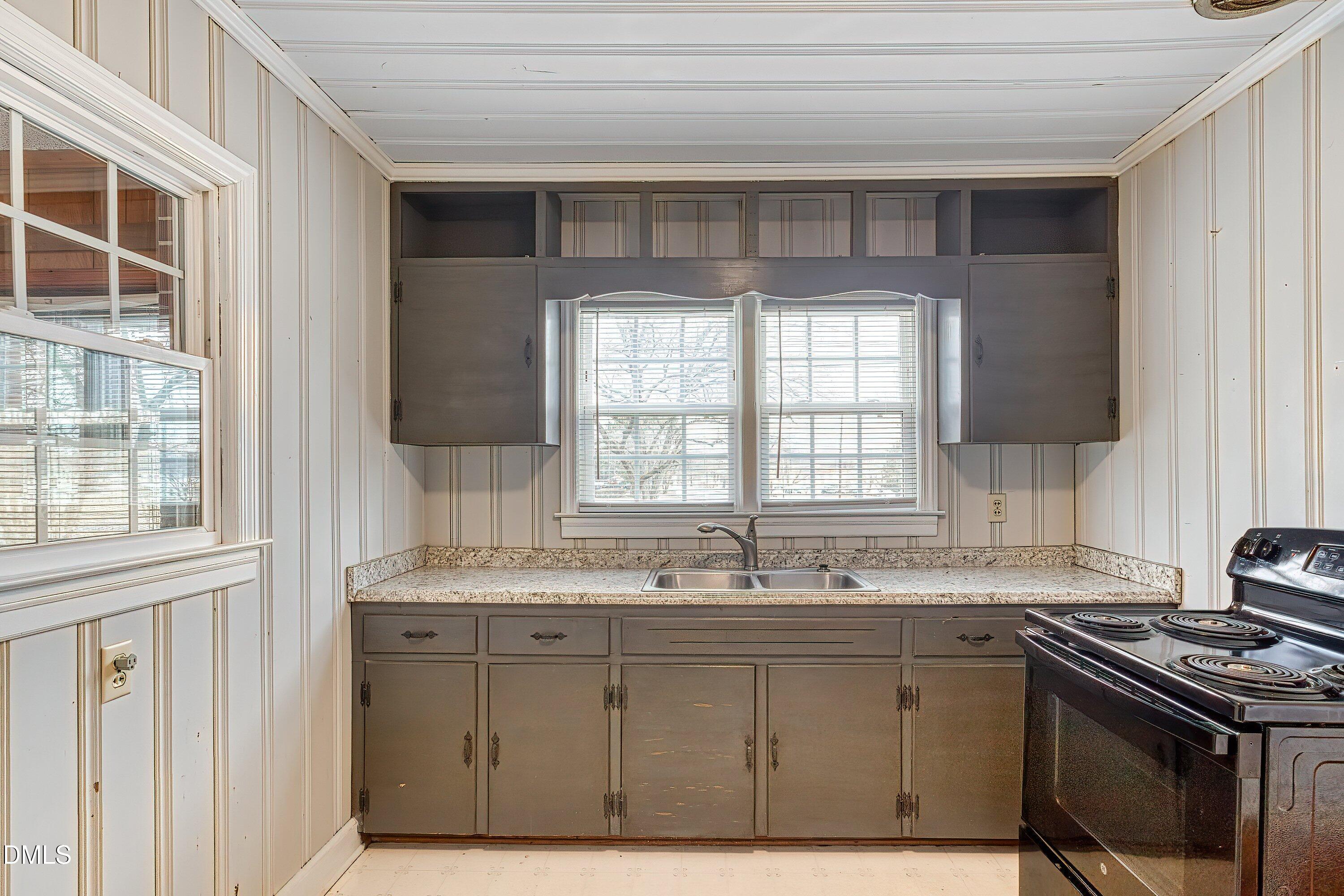 629 East Main Street Clayton, NC 27520 - Photo 6 of 39 a kitchen with a sink stove and cabinets