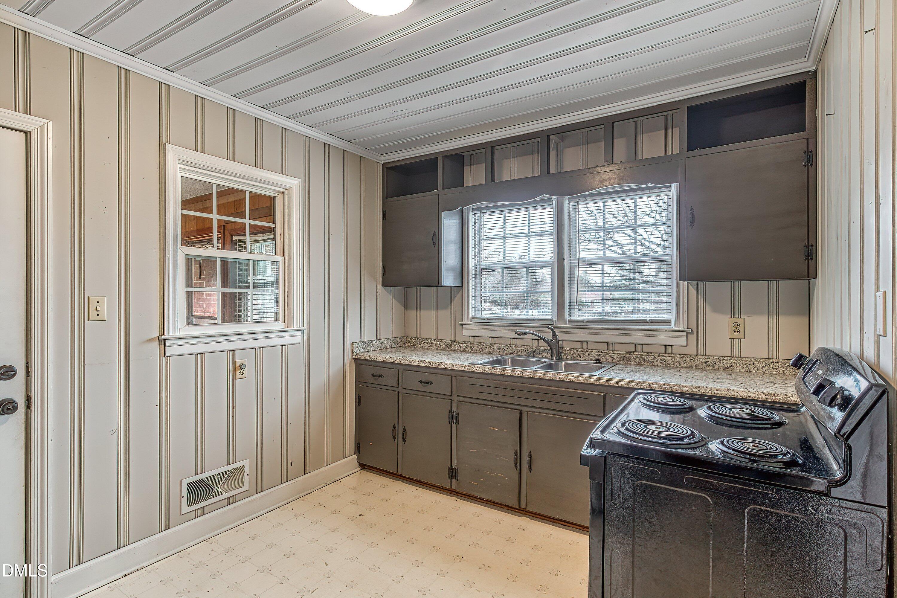 629 East Main Street Clayton, NC 27520 - Photo 8 of 39 a kitchen that has a sink and a window