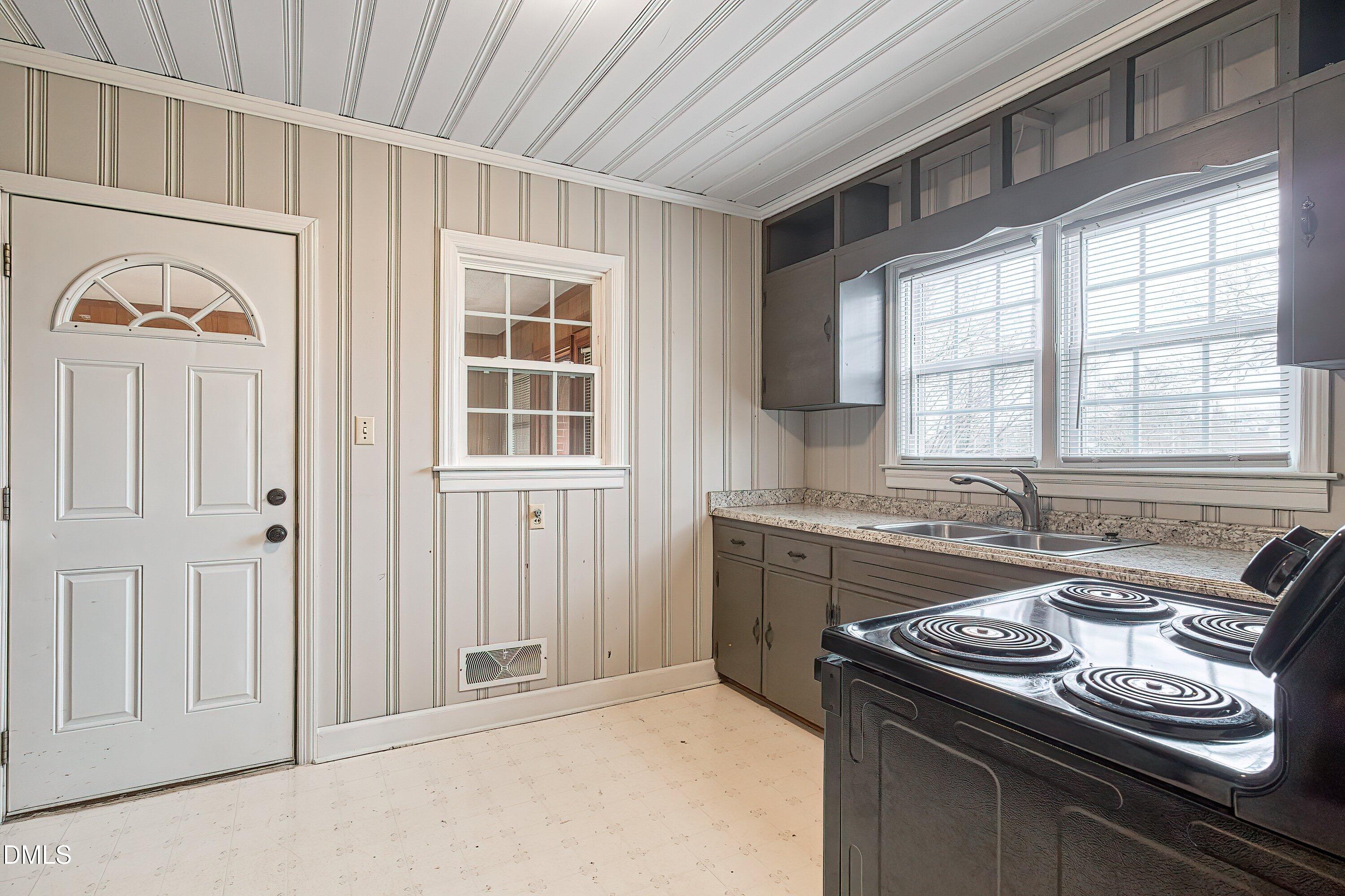 629 East Main Street Clayton, NC 27520 - Photo 9 of 39 a kitchen that has a stove and a sink