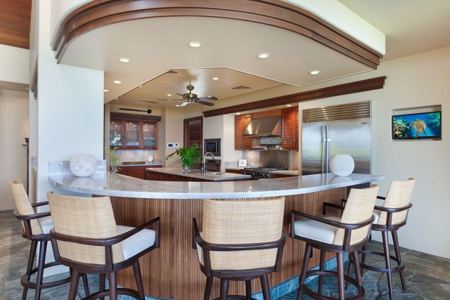 a kitchen with a table and chairs in it