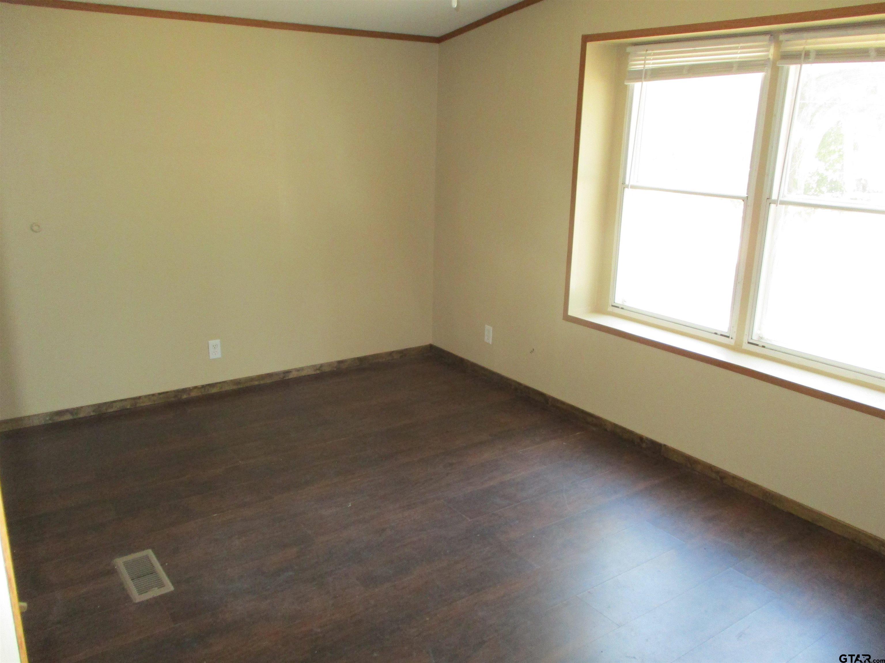 105 Sioux Lane Longview, TX 75603 - Photo 19 of 22 an empty room with a window